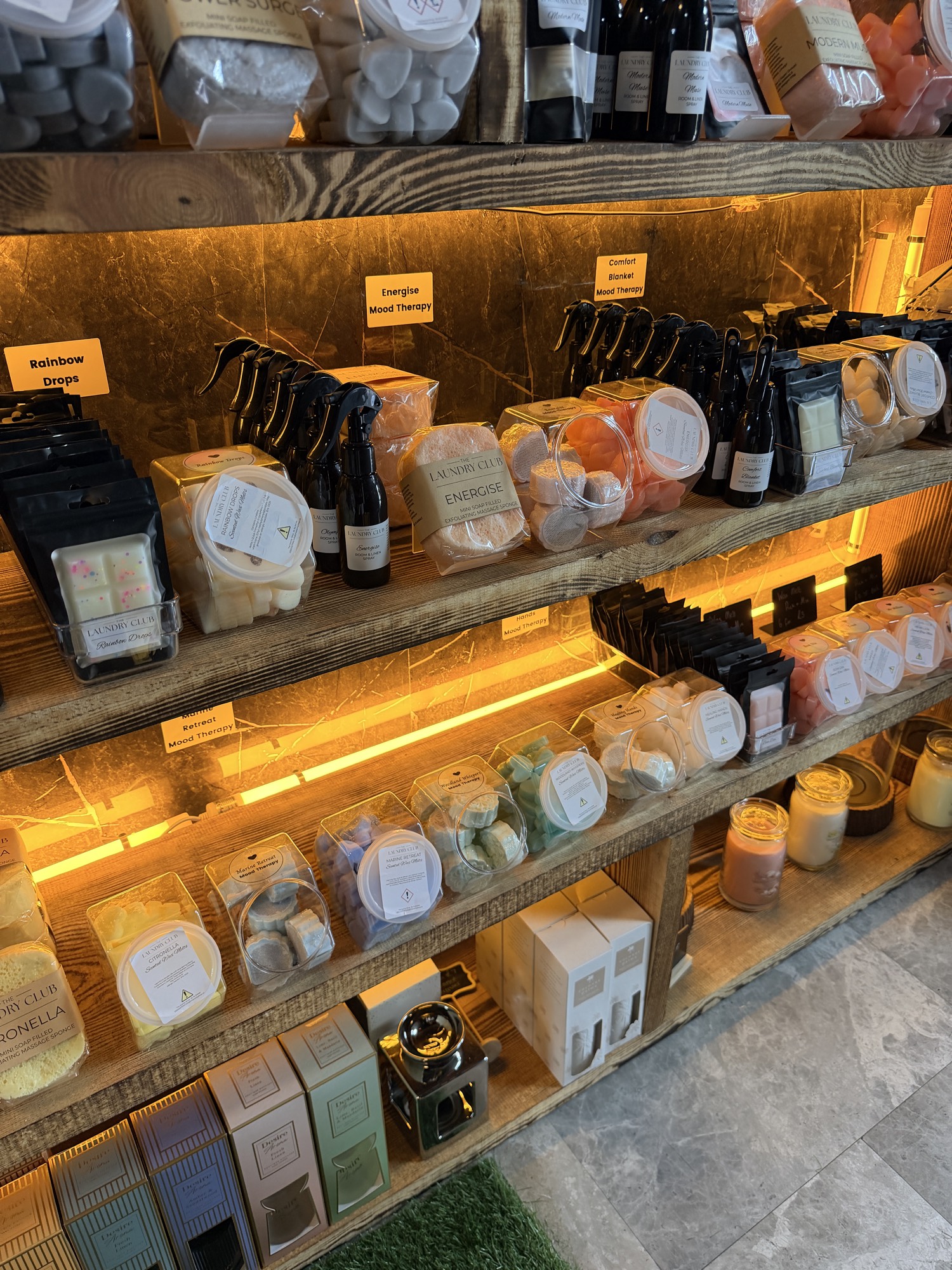 The Laundry Club scent shelves with wax melts, sprays and sponges